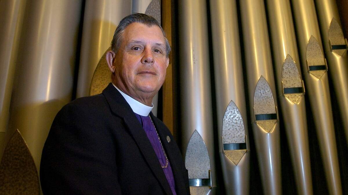 Bishop Jerry Lamb stands in front of the organ pipes at Trinity Cathedral on Nov. 18, 2004, after announcing his retirement as the Episcopal Bishop of the Northern California diocese.